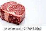 Wagyu is the collective name for a Japanese breed of beef cattle. It is one of the most expensive meats in the world. Raw red meat with fat marbling. Isolated on white background with copy space