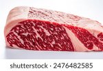 Wagyu is the collective name for a Japanese breed of beef cattle. It is one of the most expensive meats in the world. Raw red meat with fat marbling. Isolated on white background with copy space