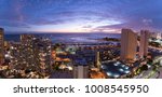 Waikiki city lights at sunset including views of the Ala Wai Small Boat Harbor, Magic Island, Hilton Hawaiian Village, Ilikai Hotel, Modern Honolulu, and Prince Hotel Honolulu