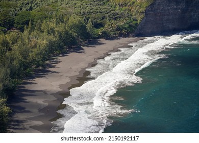Waipi'o black sand beach on the Kohala peninsula in the north of Big Island in Hawaii, United States