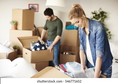 Waist up of moving house couple 