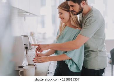 Waist Up Photo Of Happy Woman And Man Making Coffee With Machine At Home