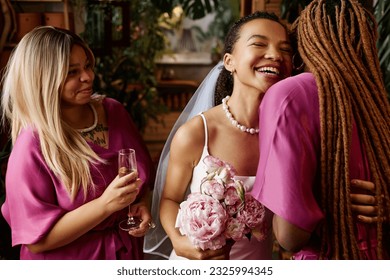 Waist up portrait of African American young bride embracing bridesmaids during wedding party - Powered by Shutterstock