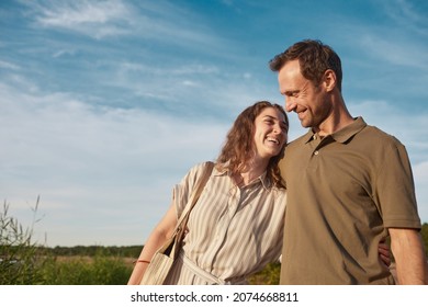 Waist Up Portrait Of Happy Couple In Nature Against Blue Sky, Copy Space