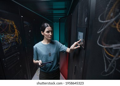 Waist Up Portrait Of Military Woman Using Control Panel While Setting Up Servers In Data Center, Copy Space