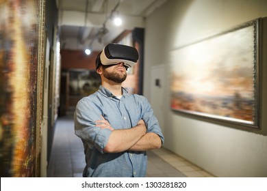 Waist Up Portrait Of Modern Man Wearing VR Headset During Virtual Tour In Art Gallery Or Museum, Copy Space