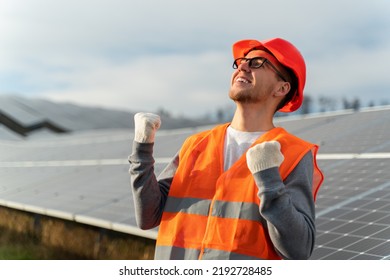 Waist Up Portrait Of Positive Male Worker In Uniform Is Feeling Proud At Work Place Near The Solar Panel