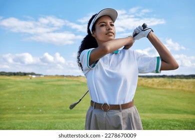 Waist up portrait of sporty black woman playing golf on field outdoors, copy space - Powered by Shutterstock