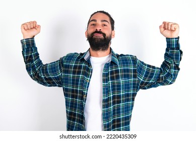 Waist Up Shot Of MODEL Raises Arms To Show Muscles Feels Confident In Victory, Looks Strong And Independent, Smiles Positively At Camera. Sport Concept.