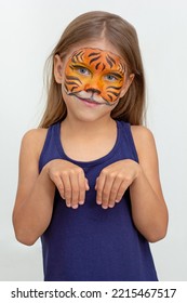 Waist Up Smiling Child With Tiger Face Painting