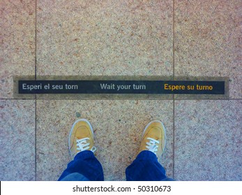 Wait Your Turn Sign, In Barcellona Airport. A Clear Concept