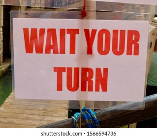 Wait Your Turn Sign In Red Lettering