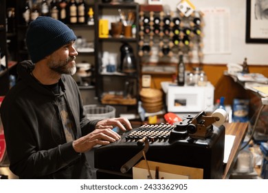 waiter cashes in at antique cash register. In a traditional bar. Old restaurant of all life. city of Toledo Spain. Jacaranda pub - Powered by Shutterstock