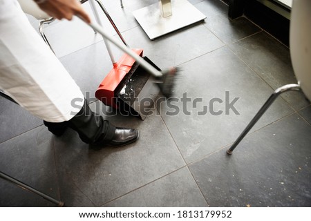 Similar – Image, Stock Photo Hand brushes to sweep and broom handle hanging on the wall in a storage room