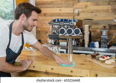 Waiter Cleaning Counter Worktop In CafÃ©