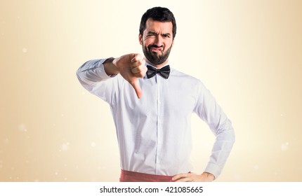 Waiter Doing Bad Signal