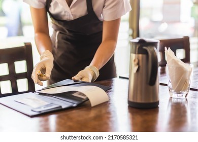 Waiter Is Giving A Bill To Customer In Restaurant.