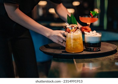 waiter hand hold cocktail glass in restautant - Powered by Shutterstock