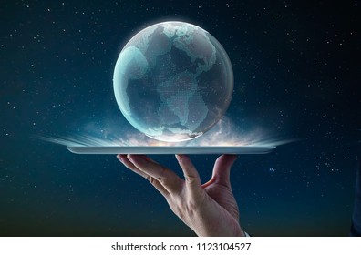 Waiter hand using digital pad holding digital glass planet earth with hologram design . Global business technologies concept. Mixed media . - Powered by Shutterstock