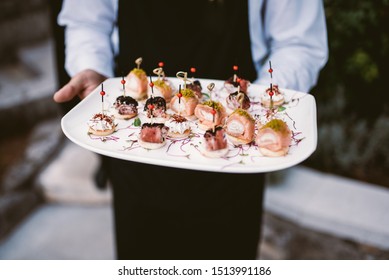 Waiter Holding Plate With Canapes 