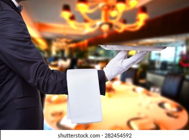 Waiter Holding A Tray At A Luxury Restaurant