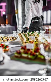 Waiter Holds Tray With Canape. Restaurant Service. Buffet Or Catering.