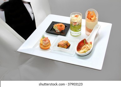 Waiter With A Plate Of Canapes