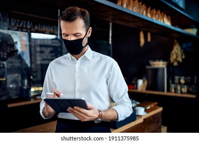 Waiter Restaurant Owner Wearing Mask Using Digital Tablet