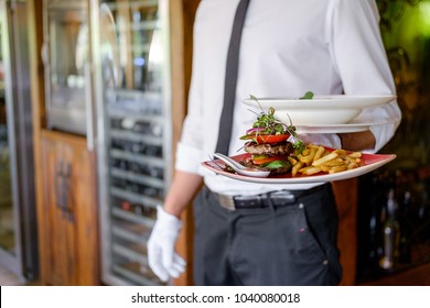Waiter Serving Gourmet Plate