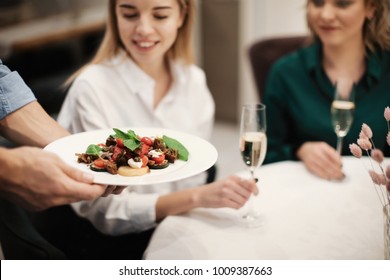 Waiter serving vegetable salad in cafe, closeup - Powered by Shutterstock