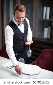 Waiter Setting The Table In A Fancy Restaurant