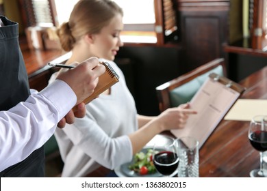 Waiter Taking Order In Restaurant, Closeup