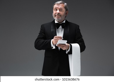 The Waiter Taking An Order Wearing A Waistcoat In A Fancy Restaurant