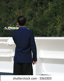 Waiter With Tray On Cruise Ship