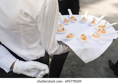 Waiter Walking With Appetizers