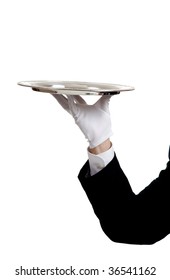 A waiters arm with a glove on the hand holding a silver serving tray with copy space