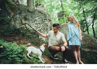 In waiting baby. happy family. pregnant woman with beloved husband walking on the grass. - Shutterstock ID 718139614