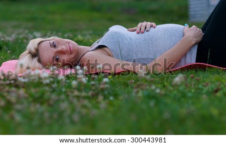 Similar – Woman in sports wear with earphones looking smartphone