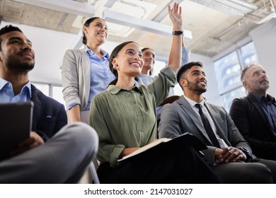 Waiting With Baited Breath. Shot Of A Group Of Business People Asking Questions During A Conference.