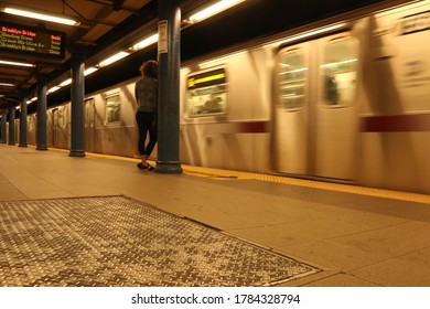 Waiting at the platform of the subway for a train to arrive