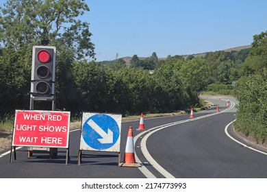 Waiting at roadworks controlled by traffic lights in Somerset, England. No traffic is approaching from the opposite direction