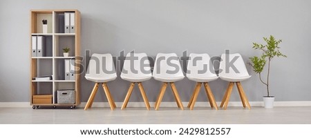 Similar – Image, Stock Photo Empty rows of white plastic seats or chairs pattern at outdoor concert event or open air theater. No audience at movie theater outdoors.