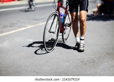 Waiting At The Starting Line. A Young Man Waiting At The Starting Line Of A Race With His Bike.