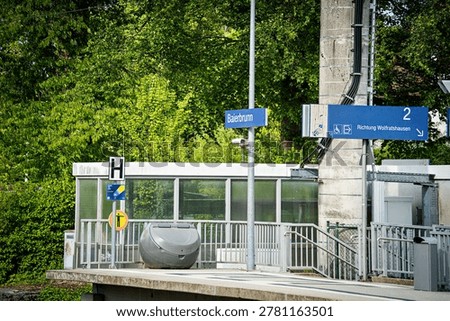 Waiting for a train at the trainstation in spring
