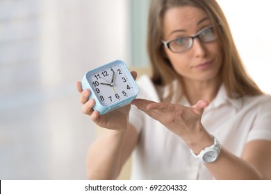 Waiting Woman Pointing At Time, Urging To Hurry, Warning Not Being Late Or Miss Appointment, Meeting Deadline, Finish Project Due Date, Focus On Clock, Time Management And Punctuality At Work Concept