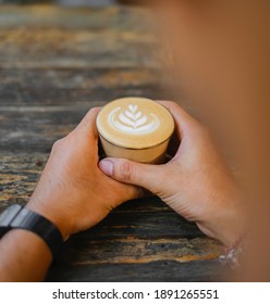 Waiting you with caffelatte on wooden background