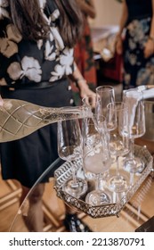 Waitress Pouring Prosecco Into 6 Champagne Glasses Wine Glasses On Silver Tray