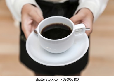 Waitress Serving Coffee Cup Close Up Of Hand Showing Coffee