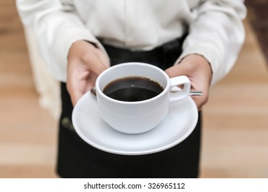 Waitress Serving Coffee Cup Close Up Of Hand Showing Coffee