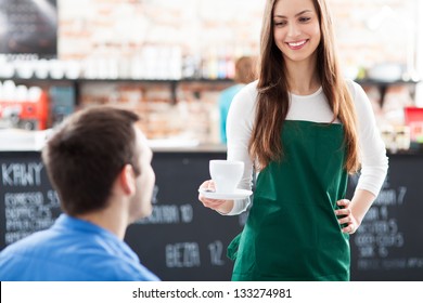 Waitress Serving Man Coffee